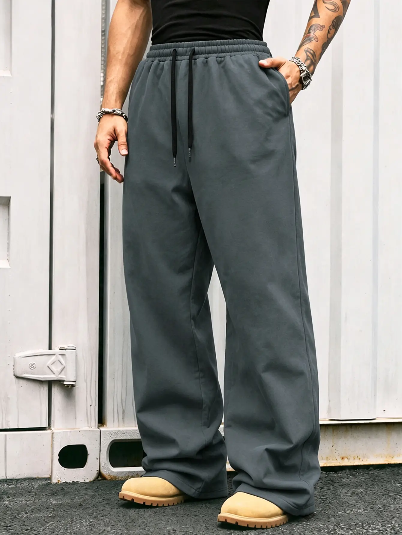 Charcoal gray loose wide-leg pants; minimalist street style with drawstring; minimalist textured look; suitable for Gen Z’s everyday wear; retro Y2K style; home loungewear; two ways to wear for streetwear; weekend casual versatile piece; relaxed sweatpant