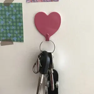 Heart shaped adhesive hooks, wall hooks, hooks suitable for keys, hats, towels, bathroom and household items.