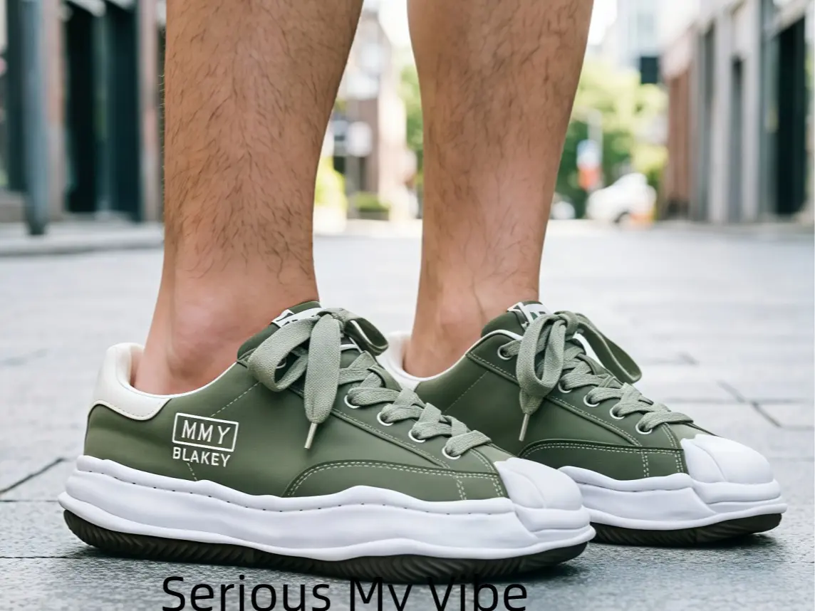 Vintage Olive Green Canvas Sneakers with Distorted Melting Sole – Retro Military Style Low-Tops Featuring a Unique Wavy Rubber Outsole and Classic Shell Toe, Perfect for Earth Tone Outfits, Cargo Pants, and 90s Grunge Fashion Enthusiasts.