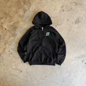 7 Cities Xchange Pop Up Size Large Black Hoodie with Green Logo Zip-Up Jacket