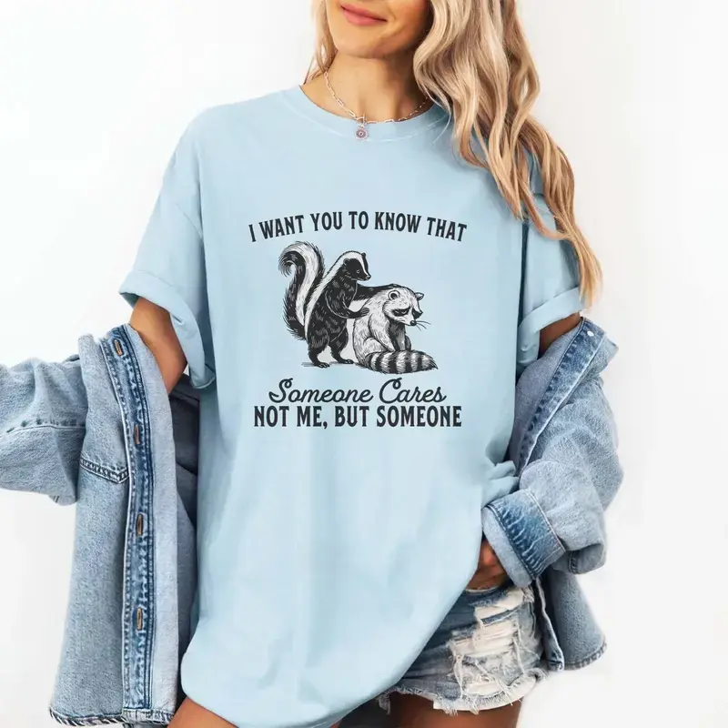 Women's Casual Comfort Colors Sarcastic Animal Graphic T-Shirt - Funny Skunk Raccoon Print, "Someone Cares Not Me But Someone" Message, Comfortable Fashion Apparel Piece