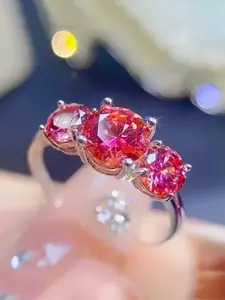 A 2/4-carat red moissanite ring in vintage 925 sterling silver, set with three round-cut gemstones. Perfect for everyday wear or as a gift. Wedding Ring