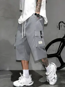 Men’s cargo shorts—knee-length tactical work shorts with multiple pockets and a street-style casual design for summer. Features an elastic waistband with drawstring, pocket patch appliqué design, and is very comfortable to wear.