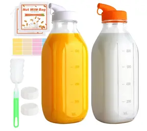 CARBLIN 32 Oz Glass Milk Bottles, 2 Pack Scale Mark Drinking Jug with 2 Nut Milk Bags& Airtight Screw Lid & Silicone Pour Cap& Stickers, 1 Quart Reusable Juice Bottle Water Pitcher for Coffee Yogurt