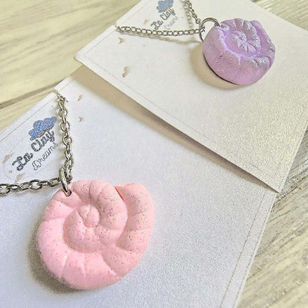 Nautilus shell necklace handmade with high-quality polymerclay and stainless steel chain. light pink and purple color choices with glitter