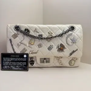 Pre-owned CHANEL 2014 2015 Lucky Charms Reissue 2.55 Flap Bag in Quilted Aged Calfskin, Off White with Ruthenium Hardware (Serial No. 20841822) A116 HK