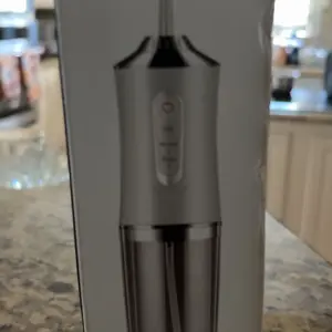 Electric Water Flosser Oral Irrigator, Portable Dental Care Device, Effective Plaque Removal, Easy to Use, Ideal for Home & Travel