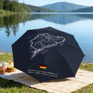Portable folding umbrella The umbrella features a map outline of the Nürburgring racetrack, the text "NÜRBURGRING The Green Hell," and a German flag. Suitable for daily travel use, holiday Gift