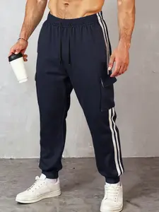 Casual sports men's elastic ankle sports pants with contrasting half side stripes and elastic drawstring waist provide excellent training performance and casual street style