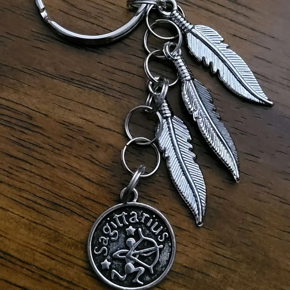 Sagittarius keychain with feather accent charms