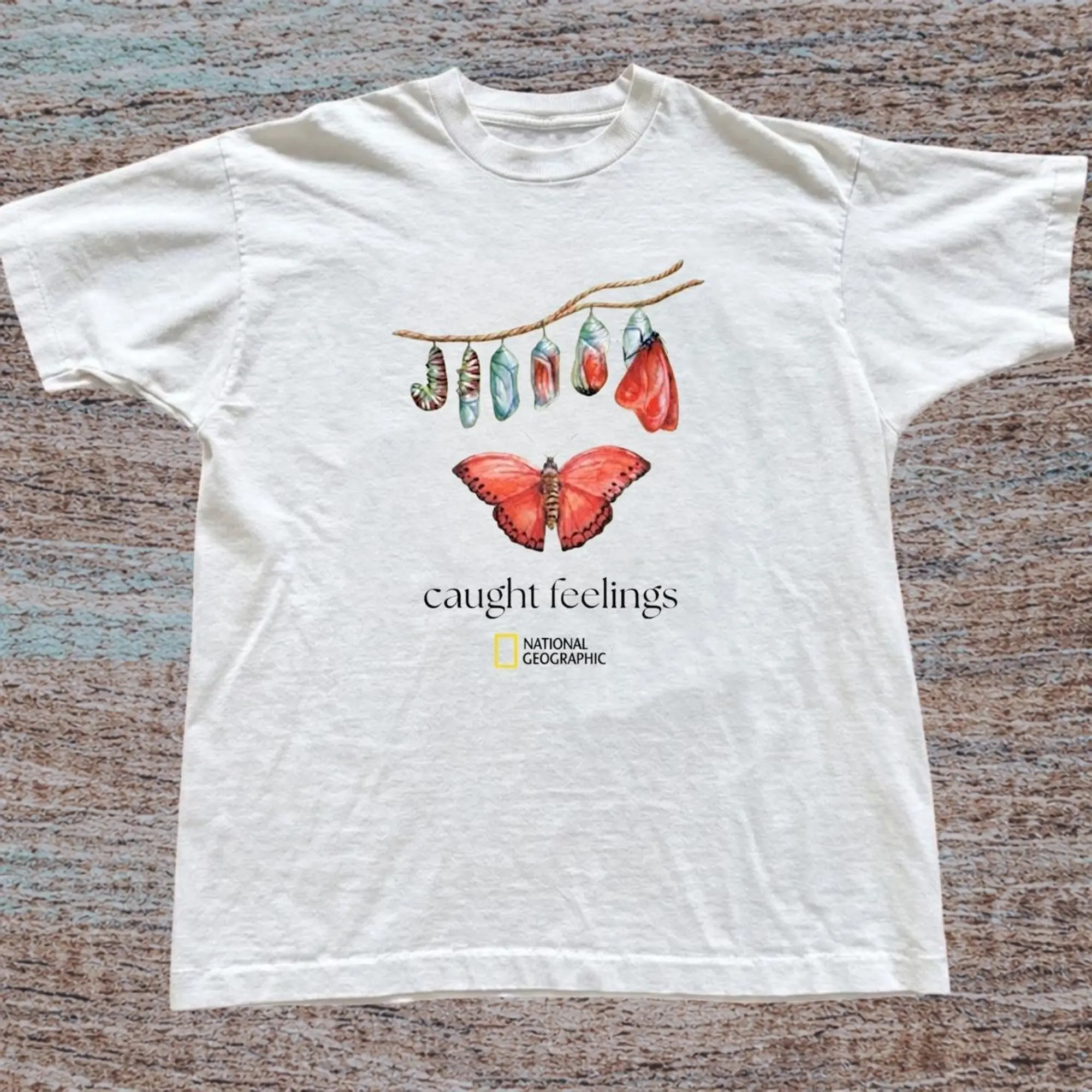 Cottagecore Butterfly Metamorphosis Graphic Tee, Butterfly Chrysalis Stages To Red Butterfly Art With Caught Feelings Slogan, Unisex Streetwear Tee For Nature Fans, Vintage Indie Outfit
