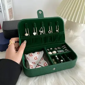 This spacious jewelry organizer keeps rings earrings necklaces and bracelets secure protected and ready for every journey