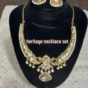 Heritage Necklace Set with Intricate Design and Elegant Stones for Special Occasions