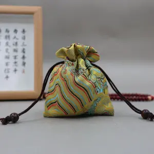 Traditional Chinese Patterns: Dragon-patterned Textile Jianzhan Gift Bag
