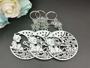US 12pcs Silver Shiny Angel Boy in the Moon Design Laser Cutout Wooden Keychain Baptism Favors with Boy Angel Recuerdos de Bautizo With Organza Bags