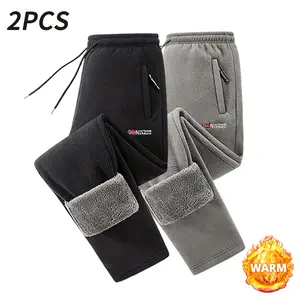 Men's three-piece jogger set with elastic waistband and cuffs, thick winter pants with side pockets, fleece-lined interior, warm lining, comfortable clothing, stretch waistband, zippered pockets, warm and cozy for autumn and winter.