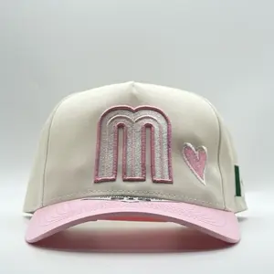 Gorra Snapback Pink Mujer Mexicana with 'M' Letter and Heart Design on Beige Background