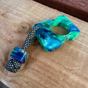 Single Finger Keychain with Unique Design and Blue Green Color Scheme