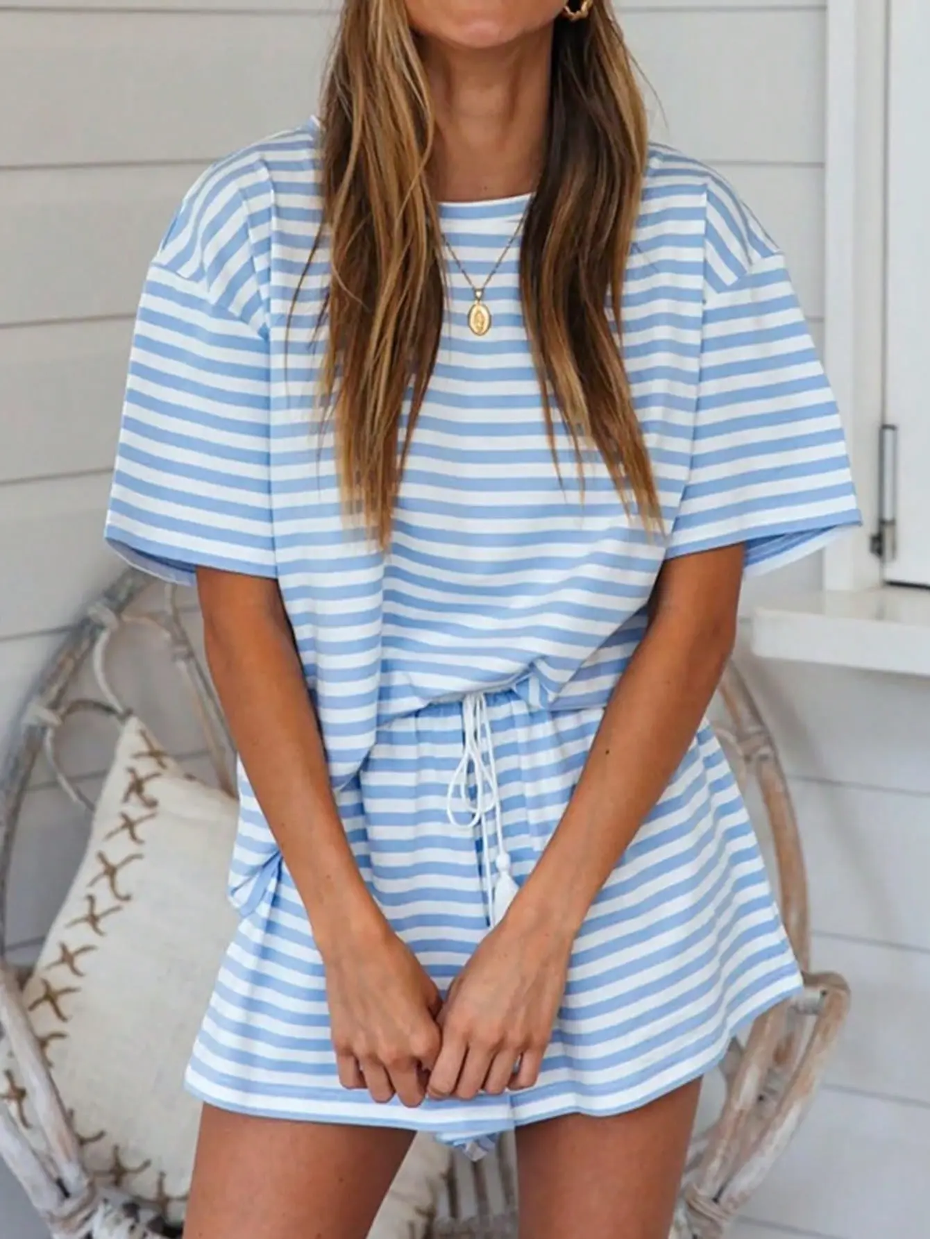 2-Piece Women's Blue and White Striped Soft Knit Short-Sleeve and Shorts Set. Simple and Fresh Design, Suitable for Spring and Summer. Drawstring Tassels, with Pockets. A loungewear set perfect for casual wear at home. Lightweight Loose