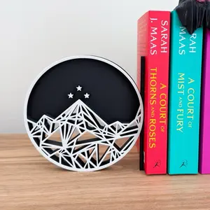 Acotar Velaris Bookend - Circular Design with Mountain and Star Pattern on Black Background