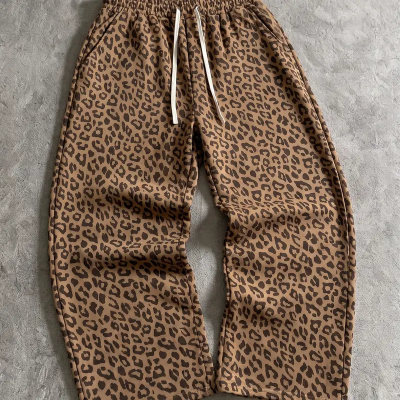 Men’s retro leopard-print loose wide-leg pants featuring a drawstring and elastic waistband, made from a soft, comfortable cotton blend fabric.Suitable for everyday wear, office wear, and home wear.