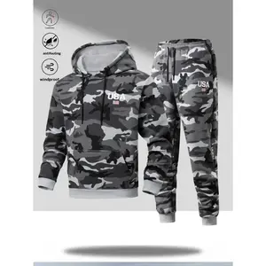 A men's military green camouflage activewear set with an outdoor energetic style, featuring a hooded design and vibrant camouflage pattern. Eye catching "USA" lettering and small flag prints add a youthful touch. The top has a large pocket for storing gea