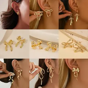 European and American retro-style gold bow earrings with hollow design, high-end fashion hot item
