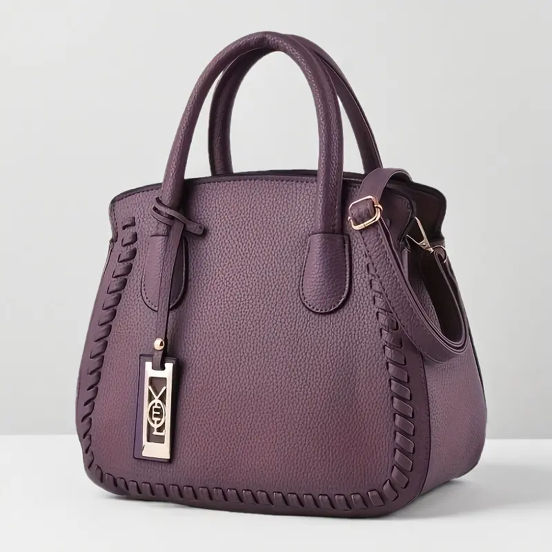 Fashionable women's handbag - elegant purple diagonal backpack and shoulder bag with woven details and zipper closure, perfect for casual or formal occasions