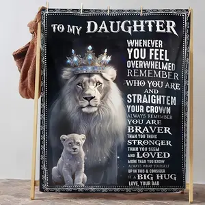 The daughter gave her father a soft wool blanket as a gift, perfect for use on the sofa or while watching TV.