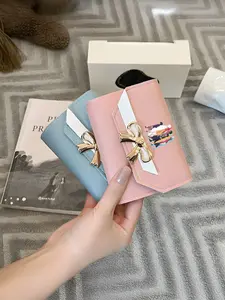 A stylish wallet featuring five young men and women and a large white robot, complete with snap closure, card holder, and multiple colors—the perfect Valentine's Day gift, Exquisite wallet