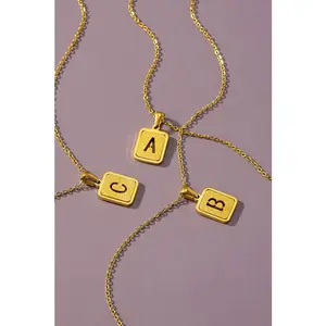 Brass diamond dust cut out initial necklace