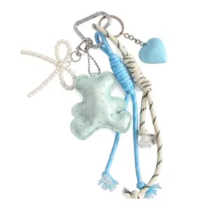 Cute Bear Bag Charm Keychain Set for Women, Layered Pearl Bow & Braided Rope Purse Charm with PU Leather Bear and Heart Pendant, Kawaii Carabiner Bag Accessory for Tote Backpack Keys
