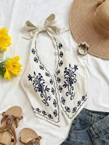SOLEMN Apricot Base Black Floral Embroidered Halter Neck Backless Bow Tie Cropped Tank Top Suitable For Music Festival