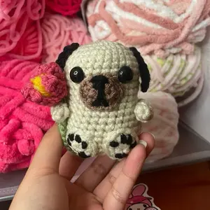Pug holding hand crochet plushie handmade