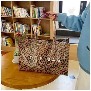 Retro minimalist style tote bag, DuPont paper handbag, fashionable letter print large shopping bag, women's PVC waterproof handbag, women's work tote bag, travel weekend bag, large-capacity commuter backpack