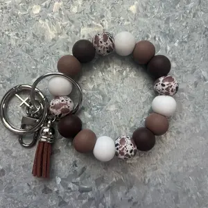 Brown Cow Print Wristlet Handheld with O-Ring for Easy Purse Attachment Cute Cow Print Design. One size fits most.