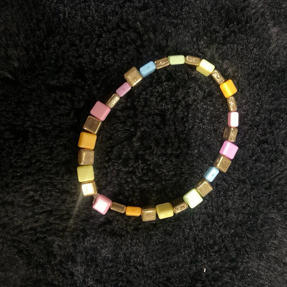 Gold colored and rainbow bracelet