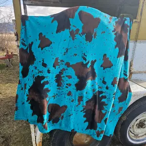 Teal Moo plush throw blanket