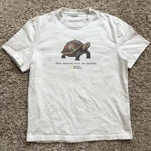 Gildan Men's and Women's T-shirt, National Geographic turtle “slow motion over no motion” tee, Animal tee, Y2k Unisex Graphic Tees Gothic Grunge Emo Scene Amity Affliction Style Clothes Menswear Womenswear Streetwear