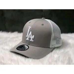 Los Angeles Dodgers New Era 9FORTY Snapback Baseball Cap – Black, flat brim, white LA logo and commemorative badge on the side, MLB streetwear accessory.