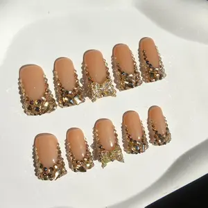 B1 Handmade nude short square press on nails with golden champagne crystal bow accents full diamond encrusted luxury salon grade