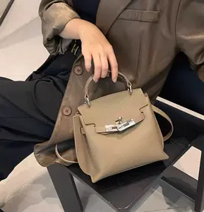 This handbag features a classic vintage Kelly-inspired silhouette combined with clean, sharp lines to deliver a high-end French aesthetic