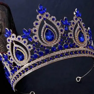 Precious and elegant royal blue crown with gold color metal. Make a statement on your special day with our beautiful crowns.  Coronas preciosas para tus quince años color azul rey con tonos dorados.