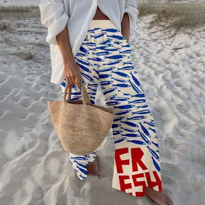 Women's nautical-style retro sardine print wide-leg pants, featuring a blue and white color-blocked design with red lettering, are loose and flowy, perfect for a stroll on the beach or a casual outing.