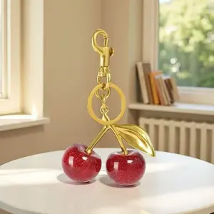 Cherry keychain bag decoration - golden tone - red shiny cherries - suitable for handbags - multi-functional and fun