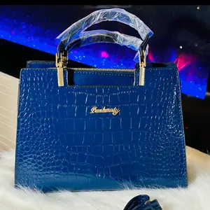 Gorgeous blue gator print hand bag with shoulder strap