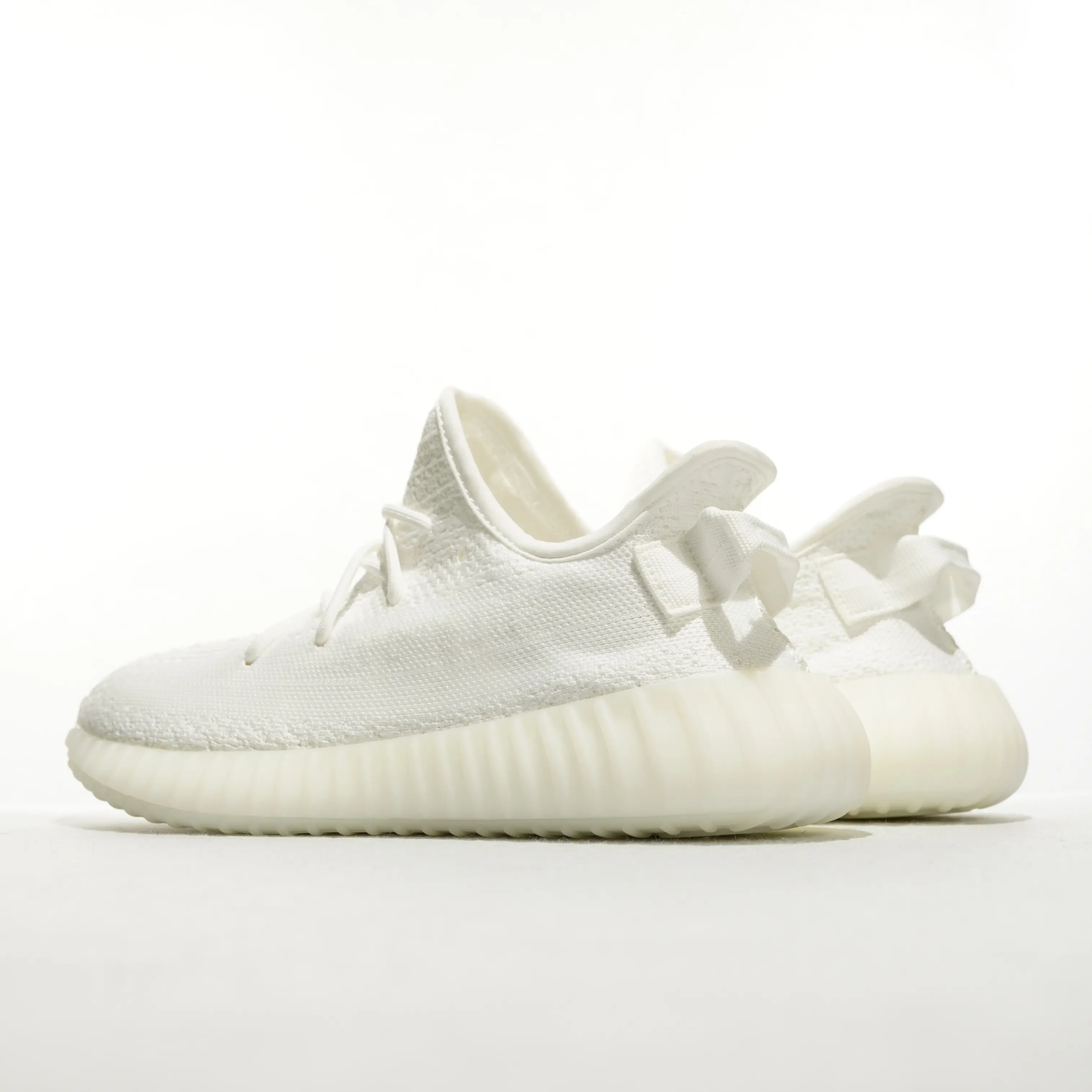 Solid Off White Stretch Knit Low Top Slip On Cushion Sneakers, Ribbed Translucent Rubber Outsole Fabric Pull Tab Breathable Casual Walking Trainers For Men Women