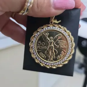 dije de centenario con diseno de torsal con circonia