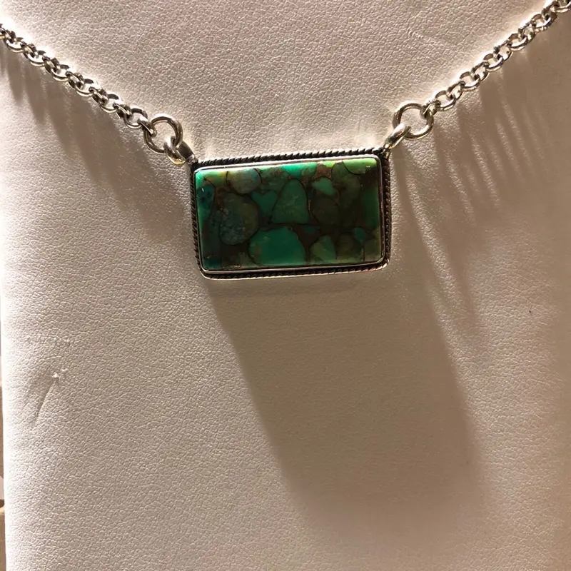 Southwest Green turquoise 20” pendant chain 925 sterling silver square pendant shape.  Beautiful detailing throughout the turquoise