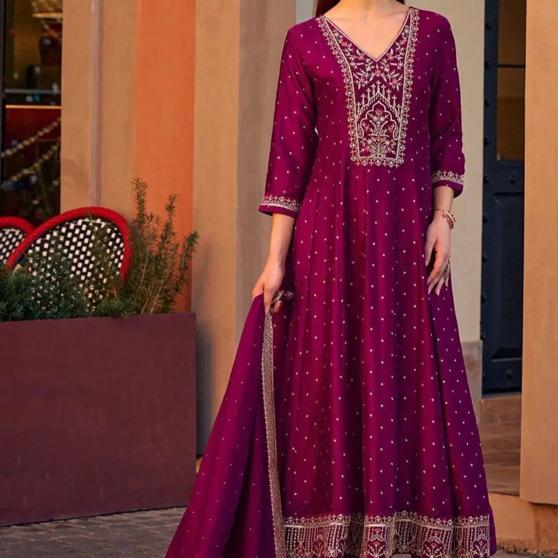 Magenta color Embroidered Art Silk Jacquard Anarkali Suit with Intricate Gold Embroidery and Flowing Design